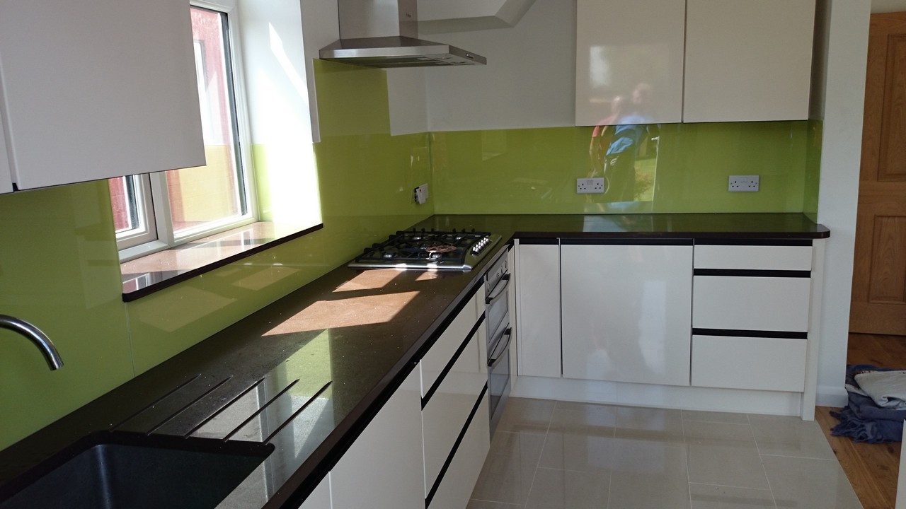 Lime green glass kitchen splashback installed by Iver glaziers