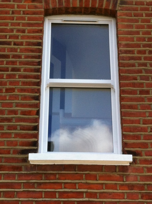 uPVC sash window on Victorian red brick house in Iver